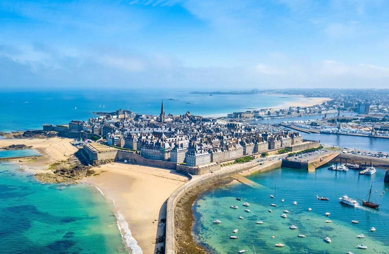 The walled old town of Saint-Malo across the water with ramparts and spire